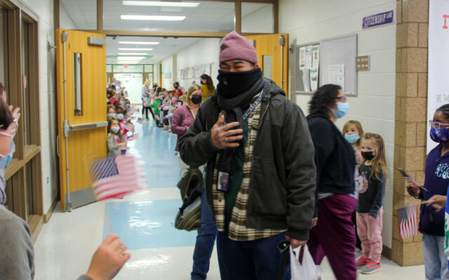 Plainfield Elementary School Students Wave U.S. Flags and Chanting Congratulations For School Custodian